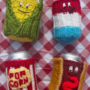 BBQ besties - knitted can cozies the depict a corn, rocket pop, hot dog - all with faces an then a retro looking popcorn bucket cozy.